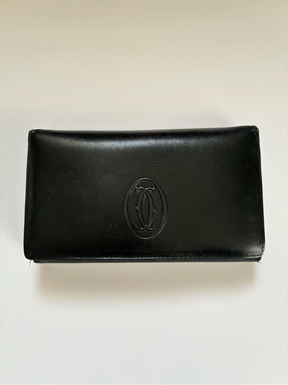 Cartier Black Leather Continental Wallet with Embossed Logo